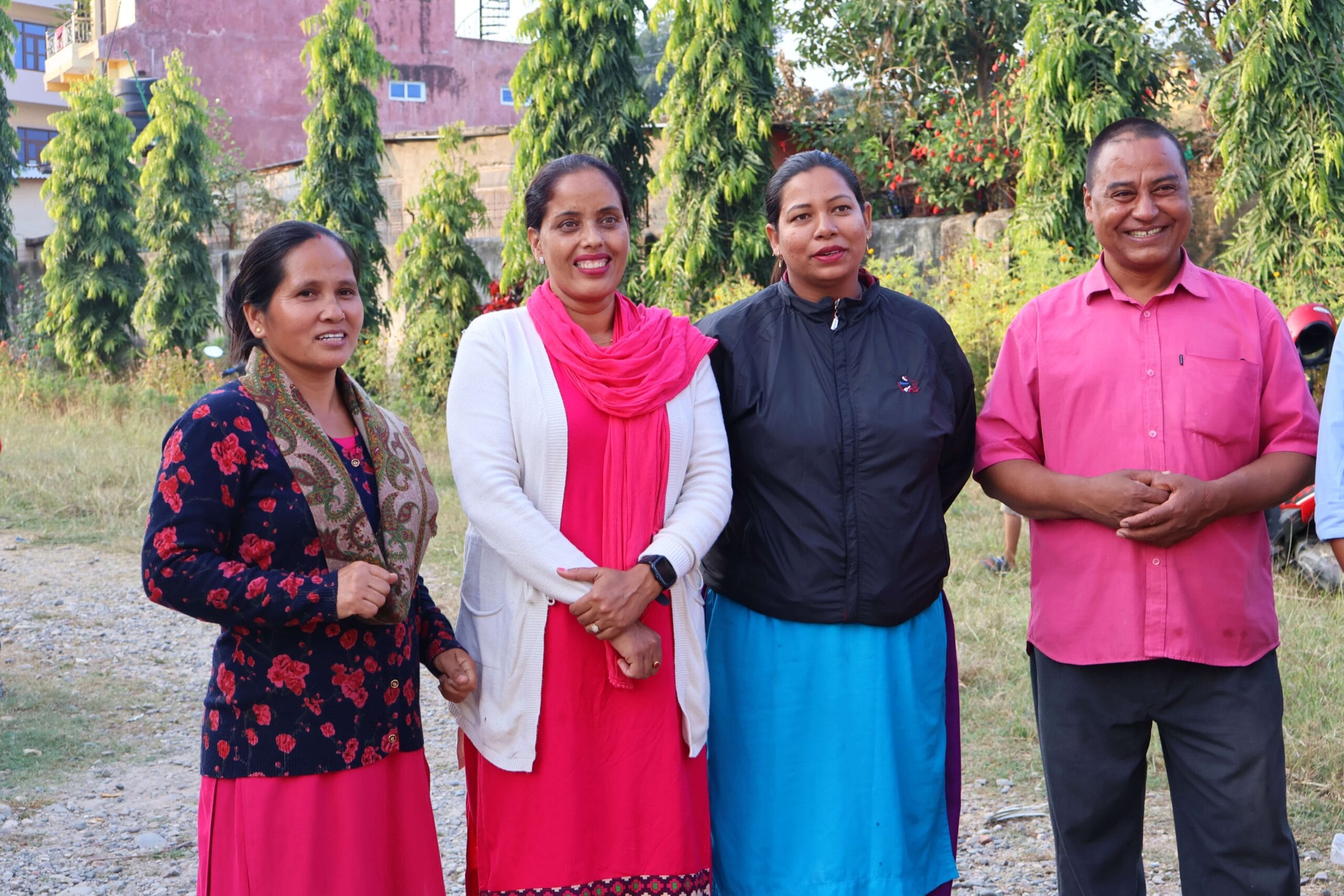 Teachers standing in a row and smiling