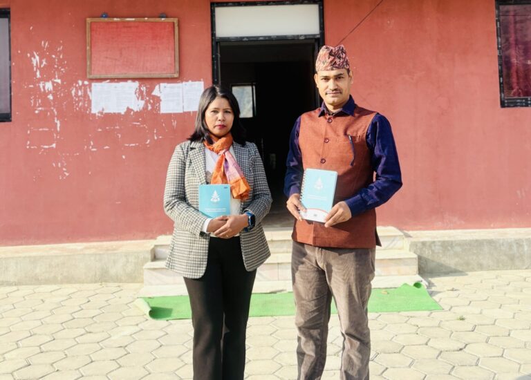 Tripti and Manoj standing in front of a local government building in Sudurspaschim