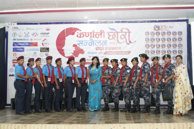 Female police officers standing in front of Daughter Conference banner
