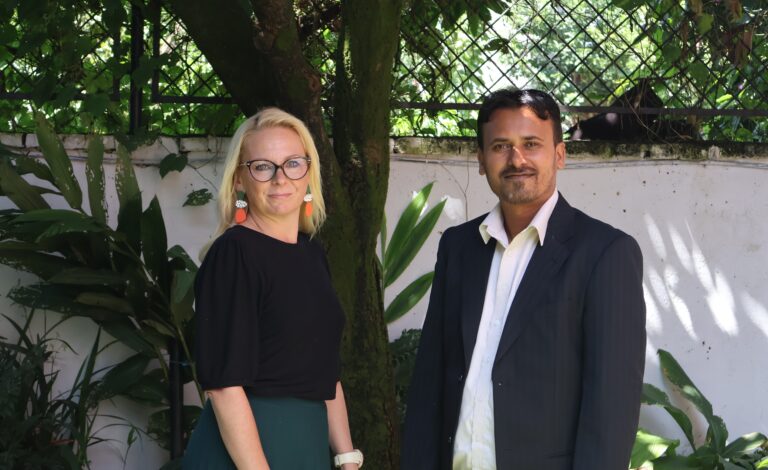 Tea Kantola and Ajay Kumar Yadav smiling and looking at the camera